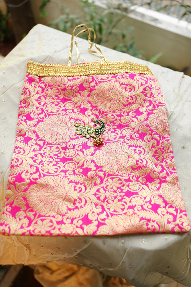 
                      
                        Festive Brocade Peacock Potli Bag
                      
                    