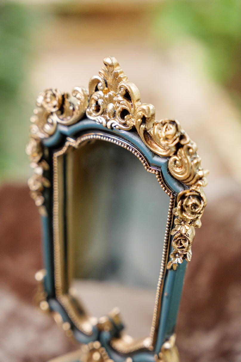 Decorative vanity mirror with teal and gold finish