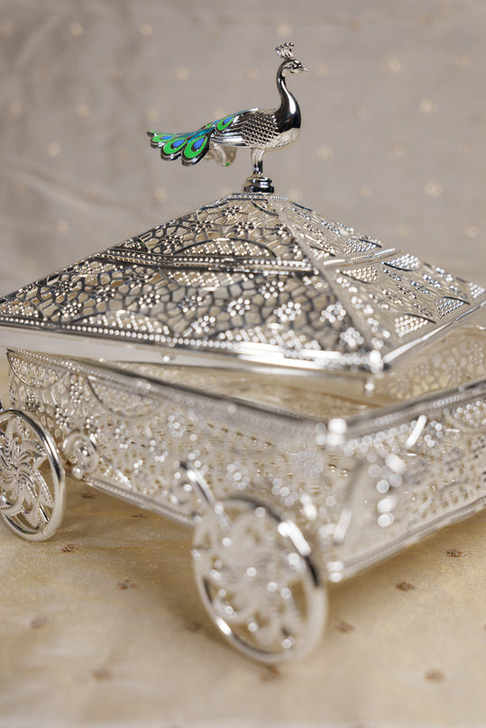 Decorative silver dry fruit box with peacock design