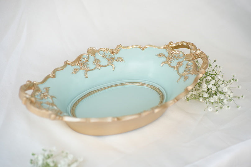 
                      
                        Elegant Aqua Decorative Bowl with Golden Detailing
                      
                    