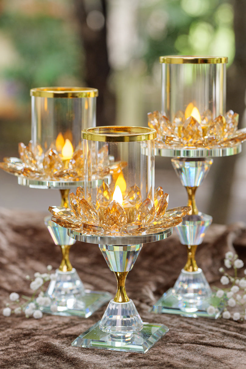Golden candle holders with glass cylinder tops