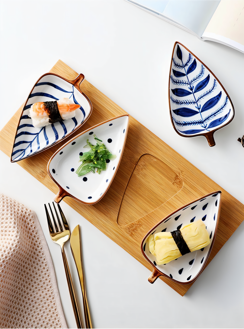 Set of four leaf design dishes