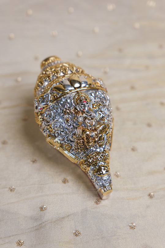 
                      
                        Ornate Silver-Golden Shankh
                      
                    
