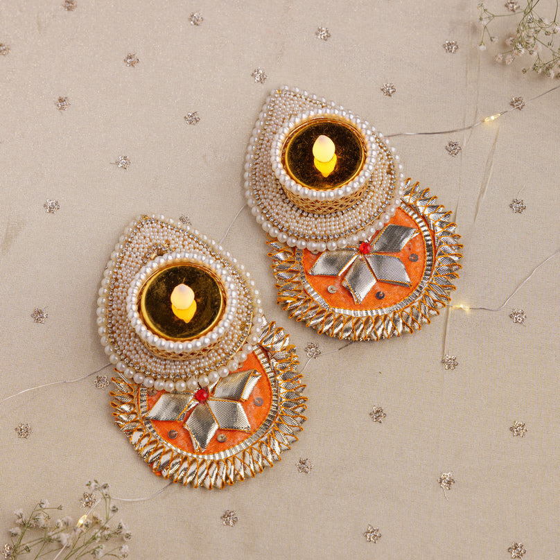 
                      
                        Pearl & Floral Decorative Diyas
                      
                    