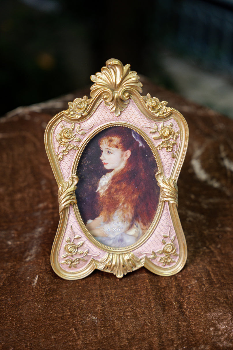 Pink and gold oval photo frame for home decor