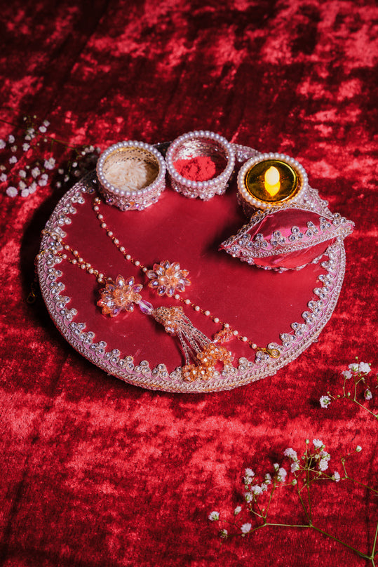 Royal red pooja thali with kundan and pearl design