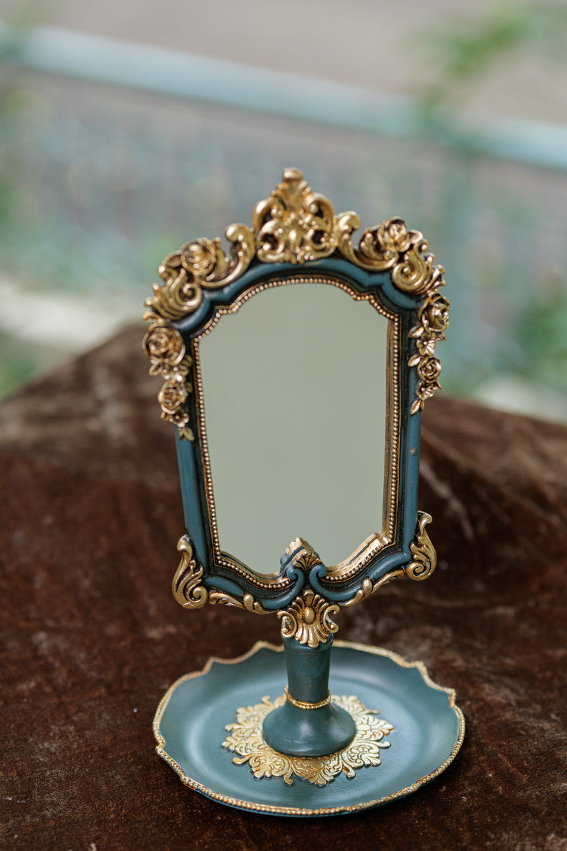 Vintage ornate tabletop mirror with baroque frame