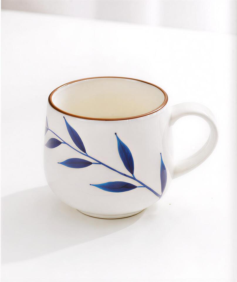 White Mug with Blue Leaf Design
